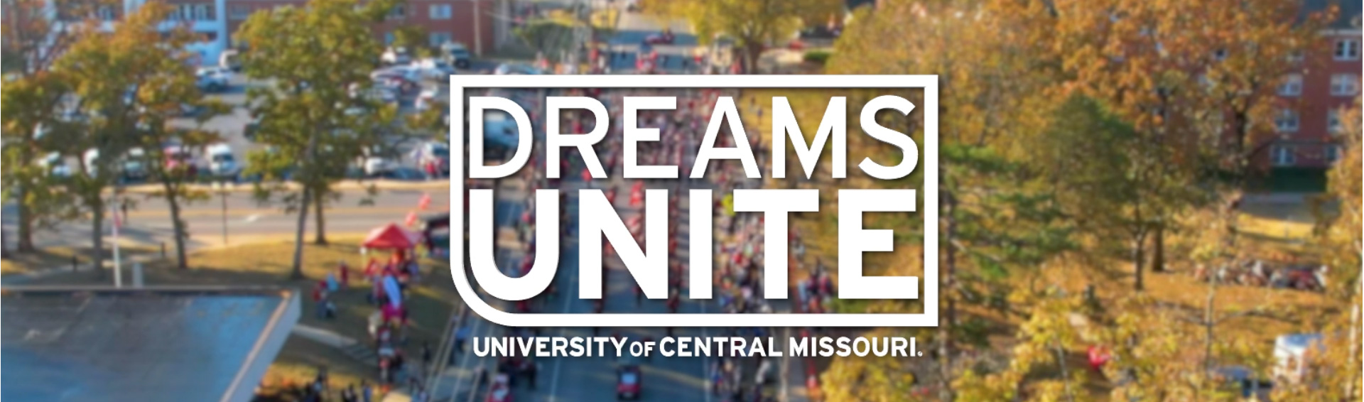 The Dreams Unite logo over and aerial view of a parade