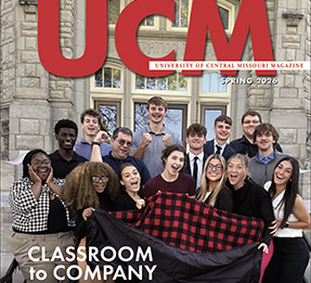 The cover of the UCM Magazine featuring a group of students posing in front of a UCM building and the words - Classroom to Company